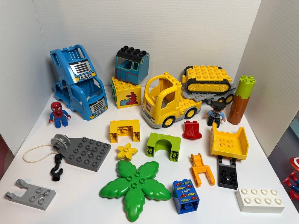 Lot of 21 Lego duplo pieces incl Spiderman figure and police officer accessories